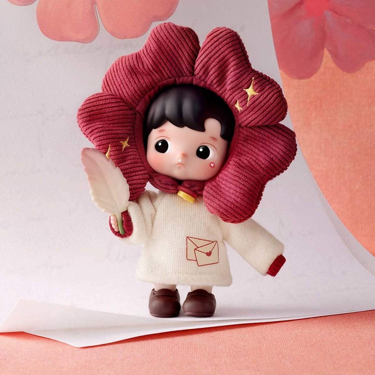 HACIPUPU Enchanted Realm Tales blind box series - design example in a red flower costume holding an envelope