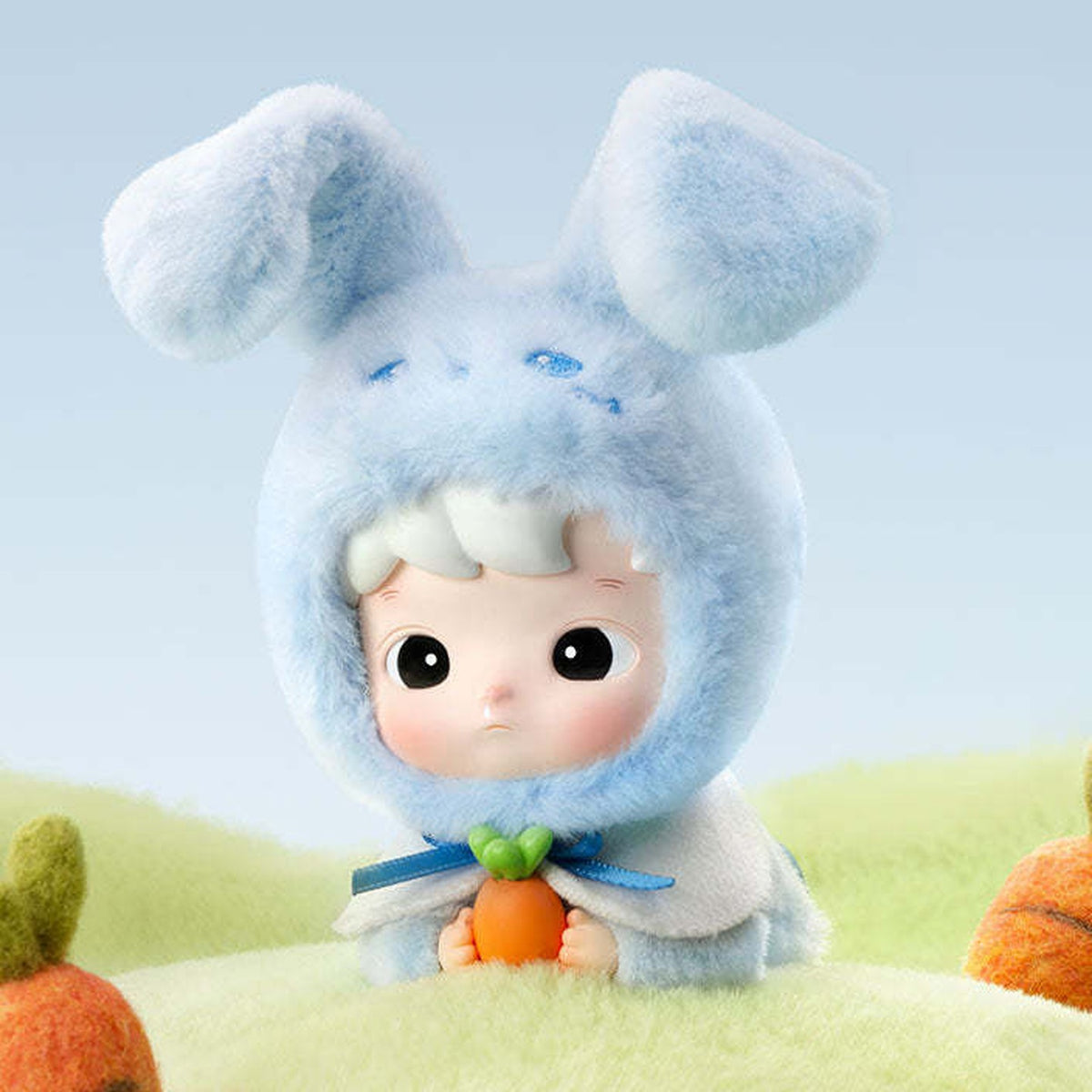 HACIPUPU Snuggle With You Comfy Bunny close-up with a blue hood and carrot; individual design reference