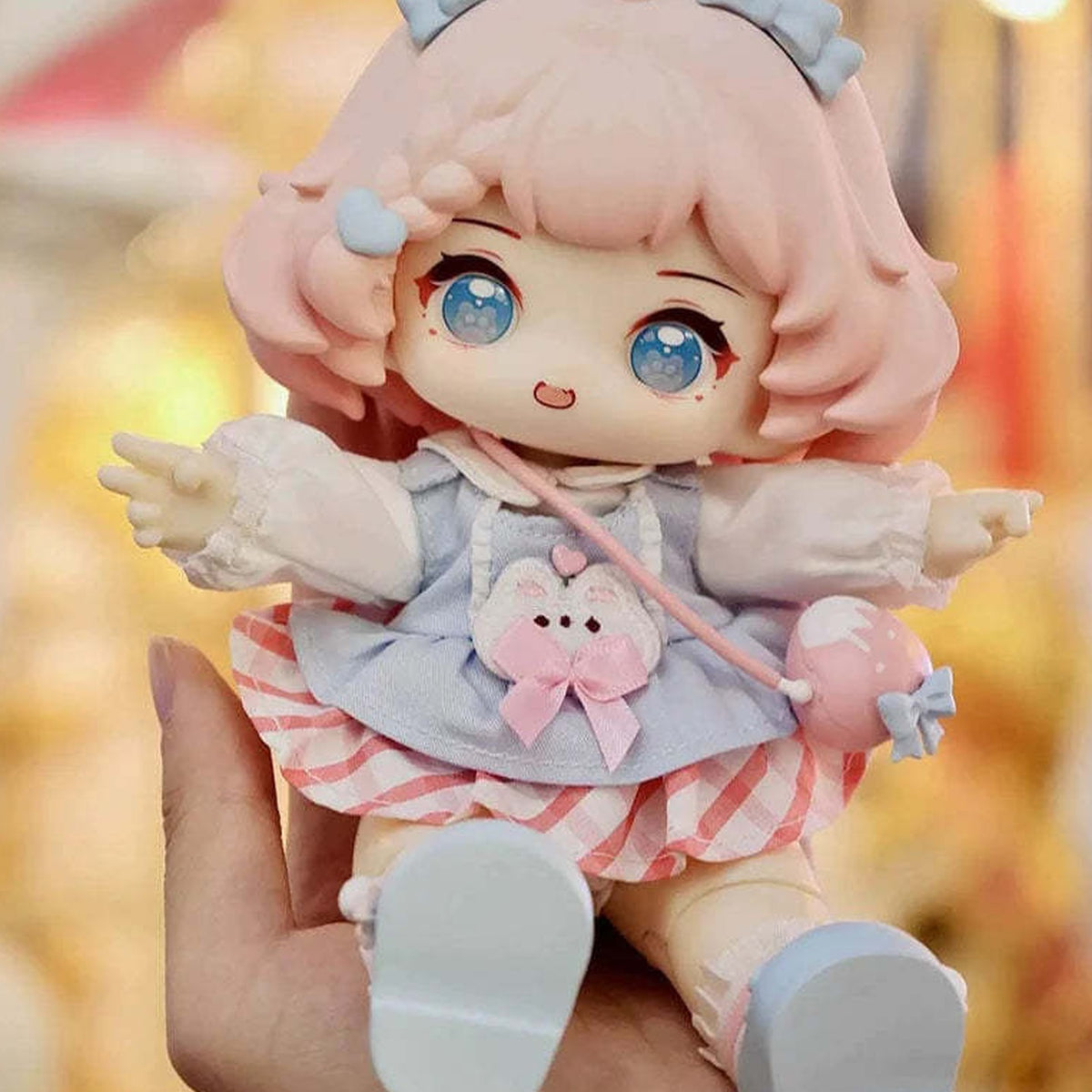 HANI Sweet Dreamland Large Size Action Figure BJD Blind Box - Pink-haired HANI in blue-pink outfit seated on a supporting hand; upper ear headwear cropped; random design not guaranteed; display props not included