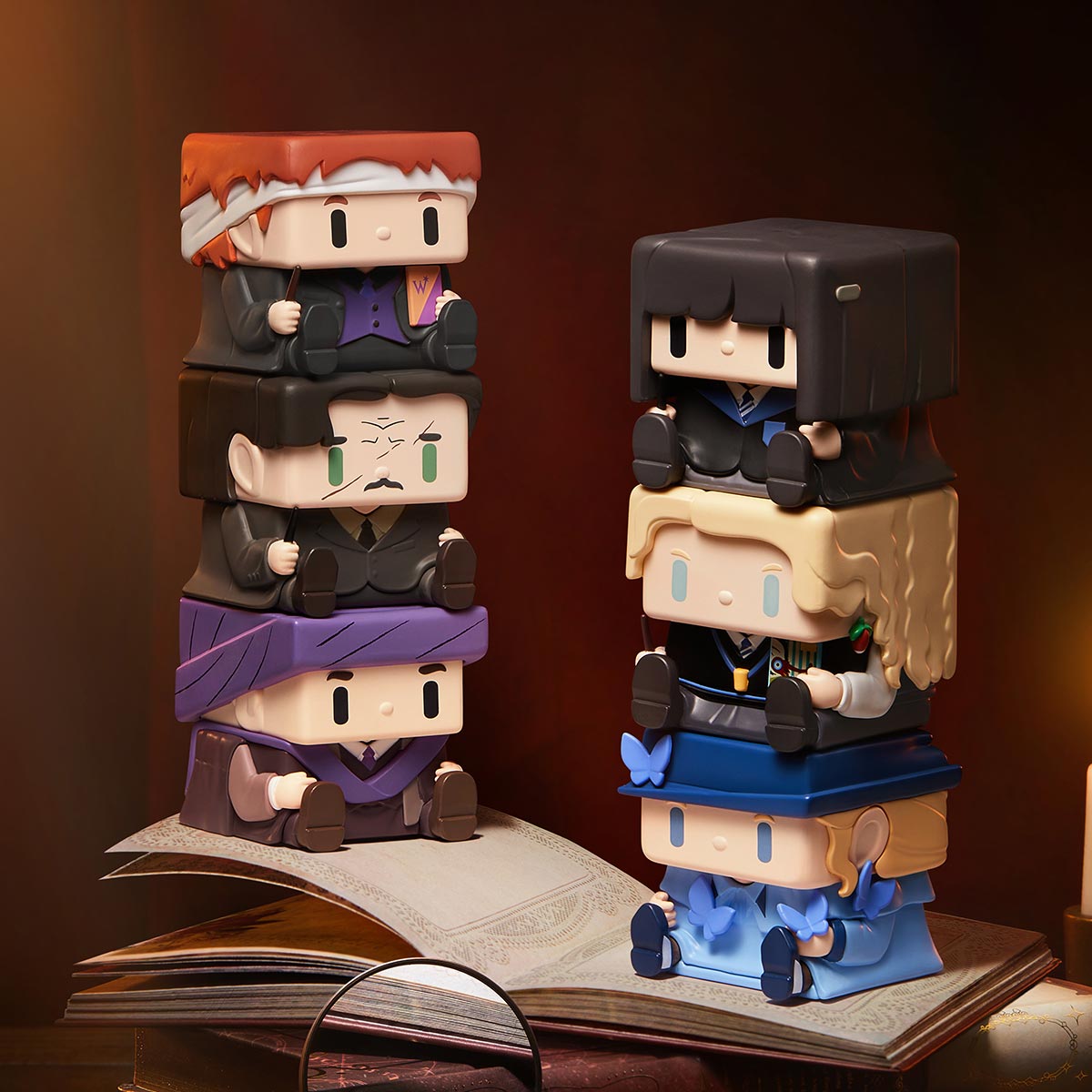 POP CUBE-3 design examples stacked above an open book; display props excluded, characters not selectable