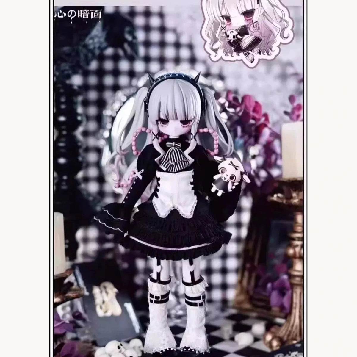 Heart of Darkness silver-haired doll in black lace-trimmed outfit with striped bow and skull ornament; costume example only, not guaranteed