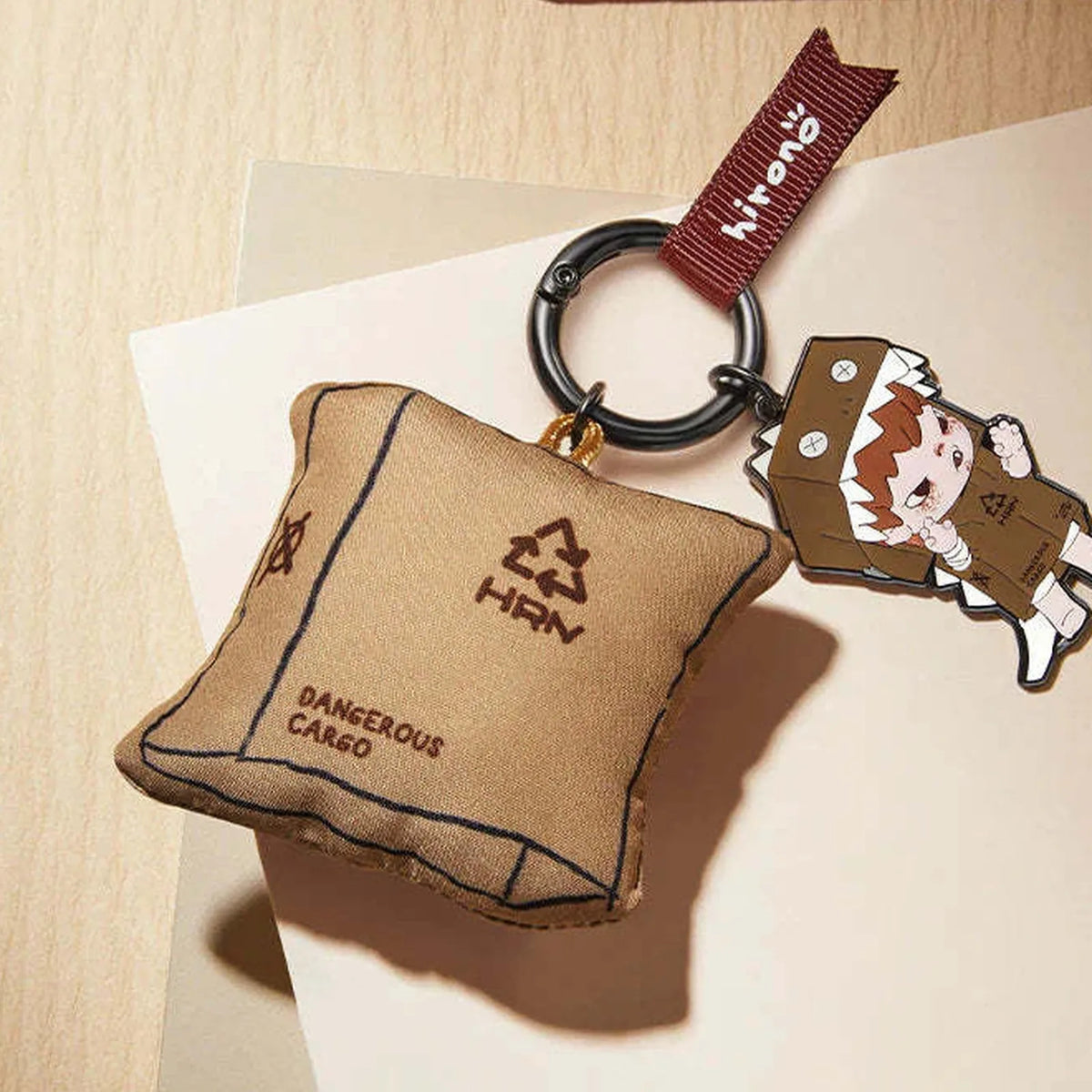 HIRONO Mime pendant series - brown parcel pendant, metal character charm and clasp detail; design example