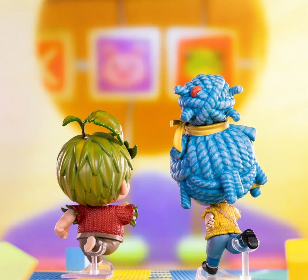 Rear view of Cody and May figures showing hair and clothing details