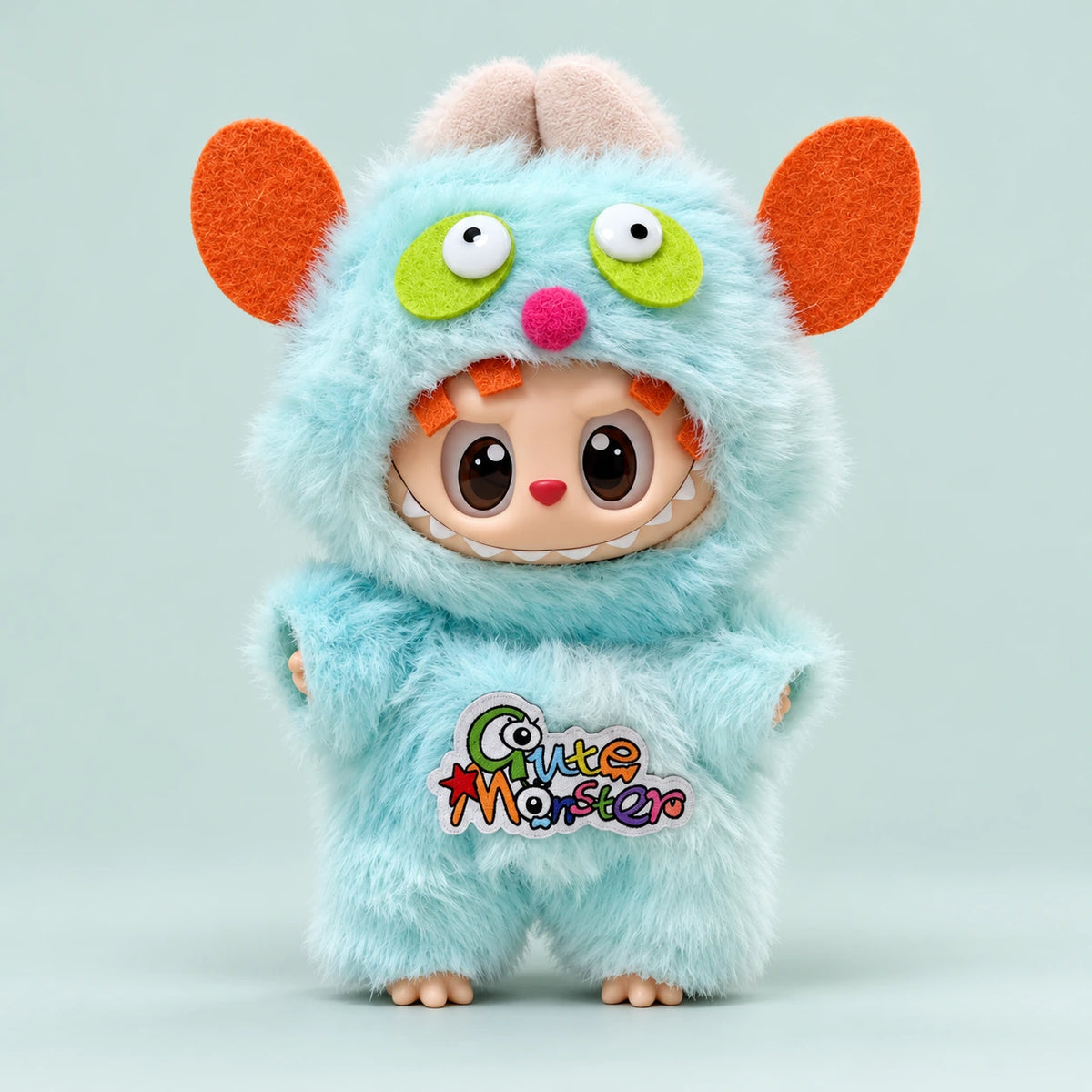 Labubu doll modeling the mint monster Halloween outfit