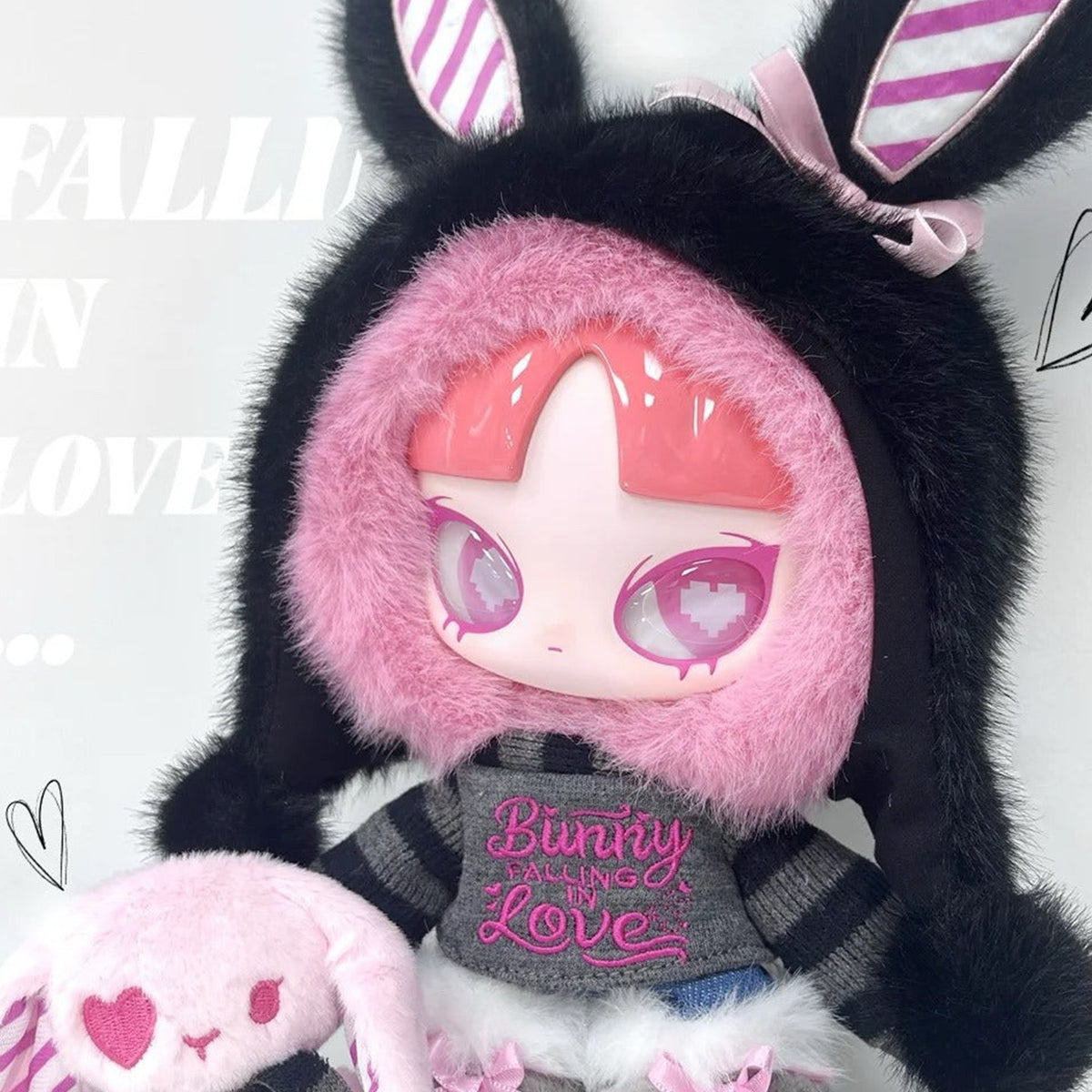 Bunny Falling in LOVE plush front-face and embroidered outfit close-up; cropped detail view