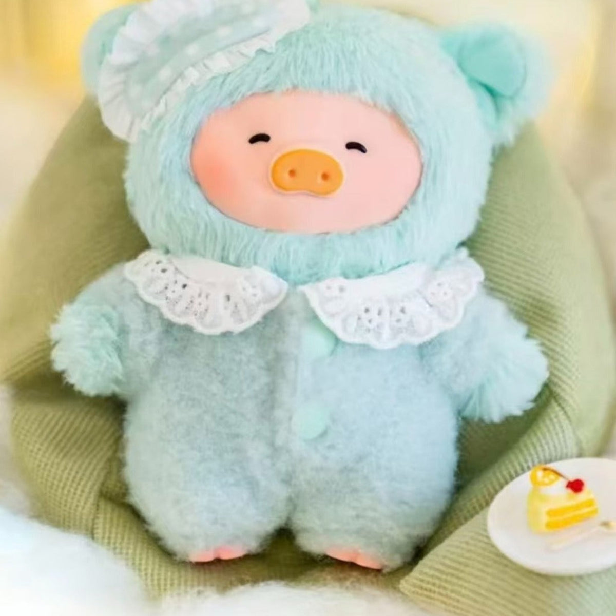 LuLu the Piggy Dreaming Wonderland mint plush design, face and clothing detail crop