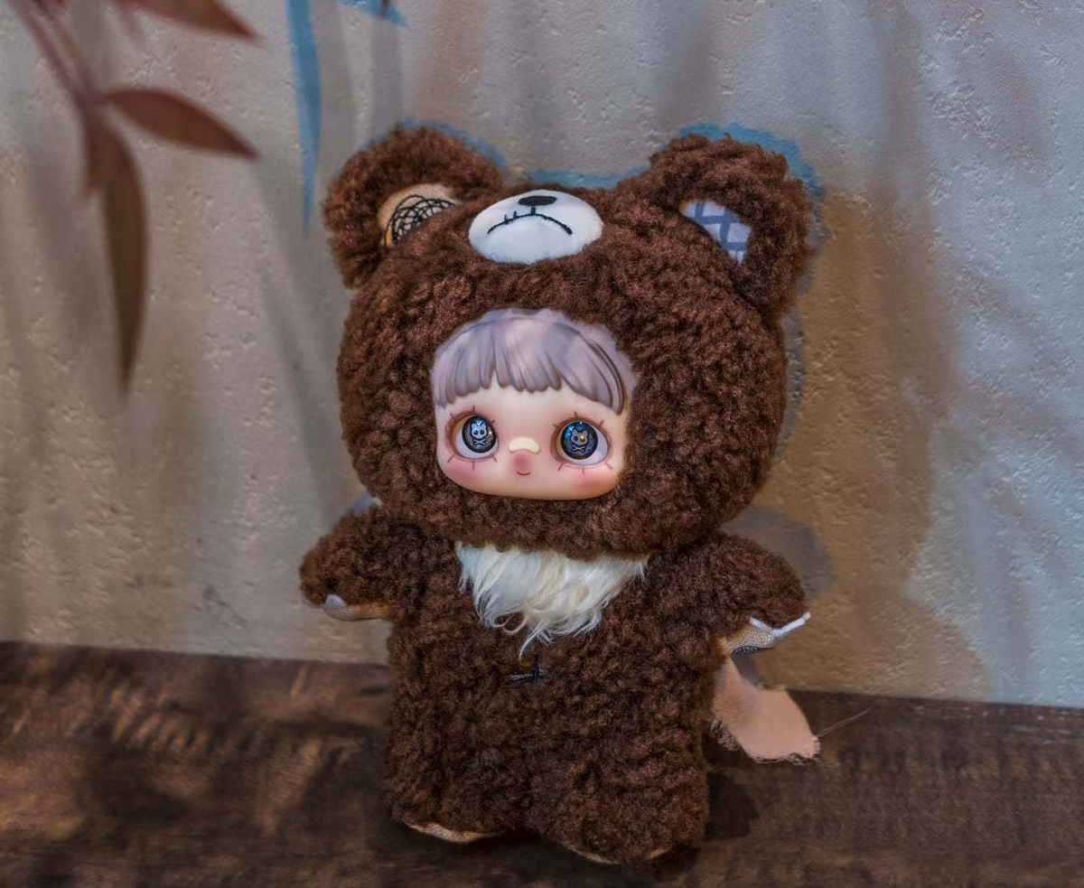 MAYMEI The Bear Bell plush doll in a brown bear costume, complete front view