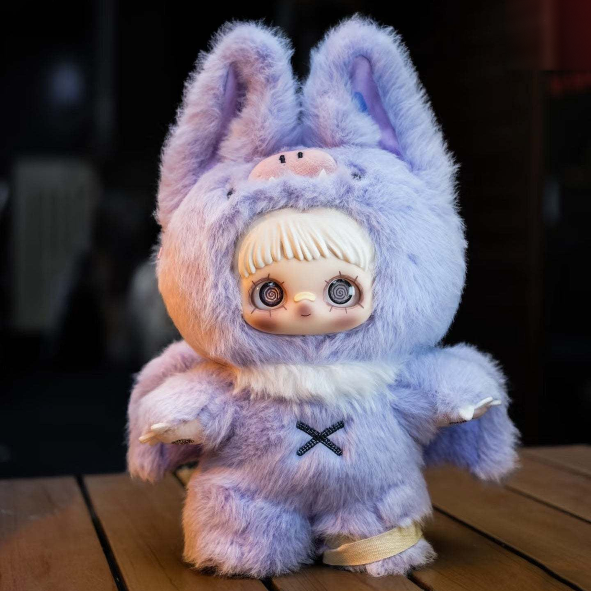 MAYMEI Vampire plush doll in a lavender pig-eared costume with spiral eyes and chest cross, complete front view