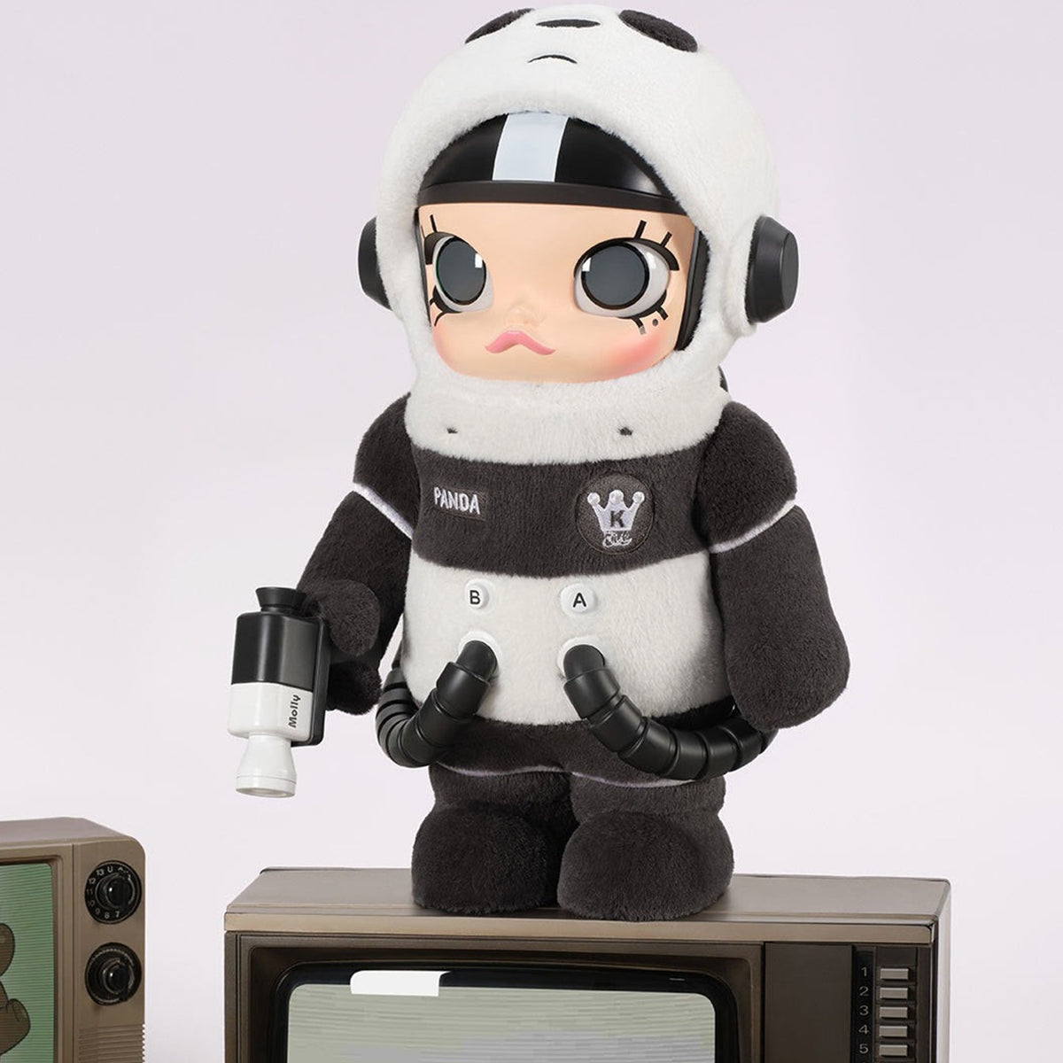 MEGA SPACE MOLLY 400% WE BARE BEARS PANDA figure in a television display scene