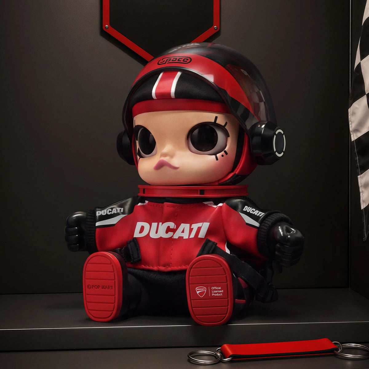 MEGA SPACE MOLLY DUCATI red vinyl plush pendant with helmet visor open; original studio display scene