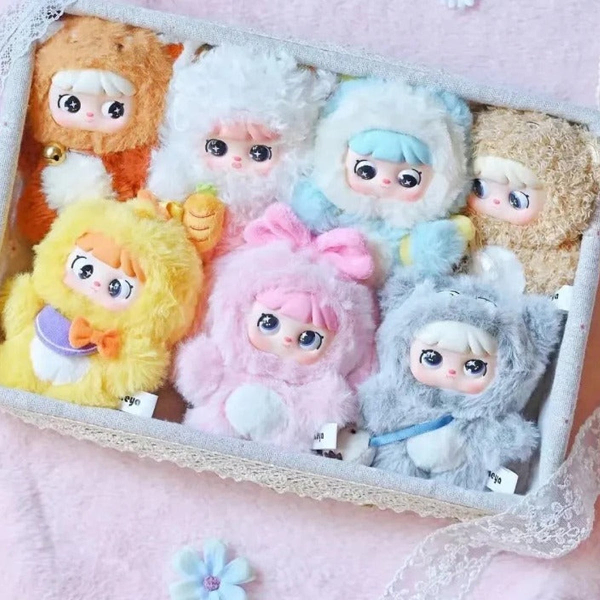 MEYA V2 Cute Pet Action Series Plush Dolls, Blind Box - Series comparison in display tray; outer examples partly obscured; random design not guaranteed