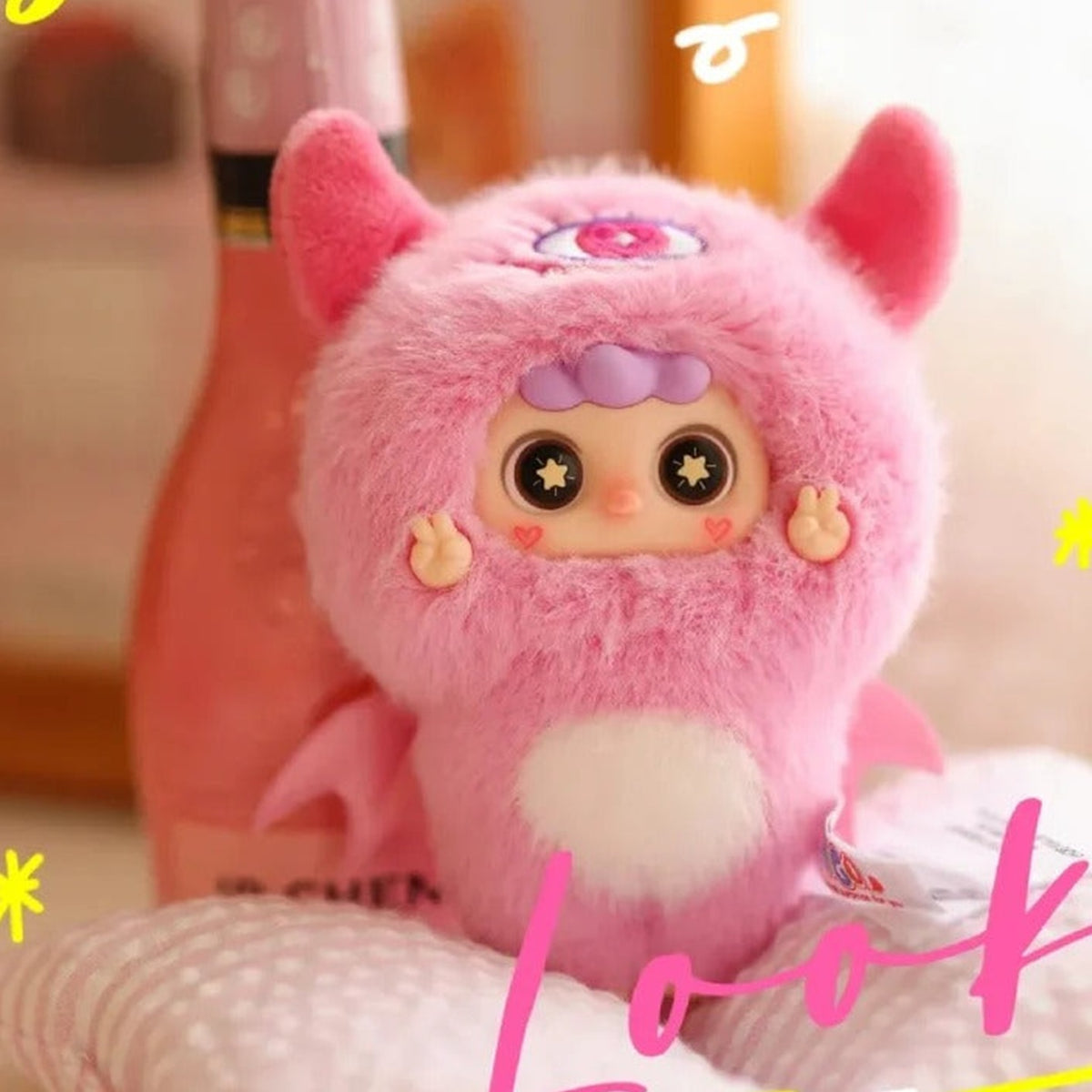 MIGO Little Troublemaker Plush Pendant Blind Box - Pink horned plush design with white belly; lower body obscured by foreground display; random design not guaranteed; display props not included