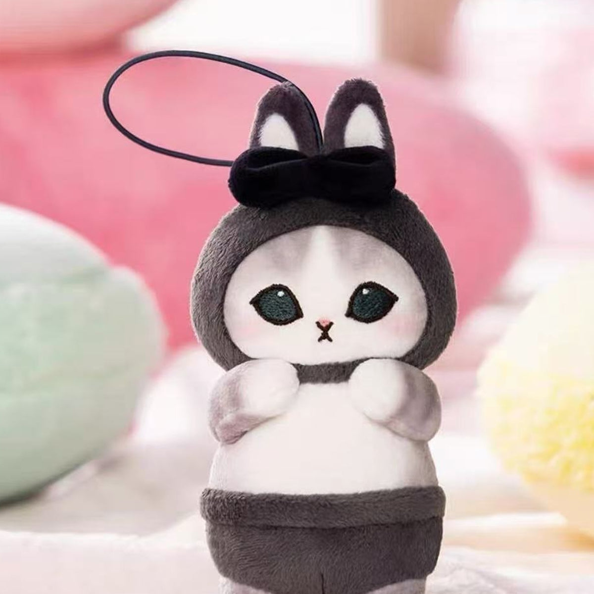 Mofusand black rabbit-outfit plush pendant, face and outfit detail