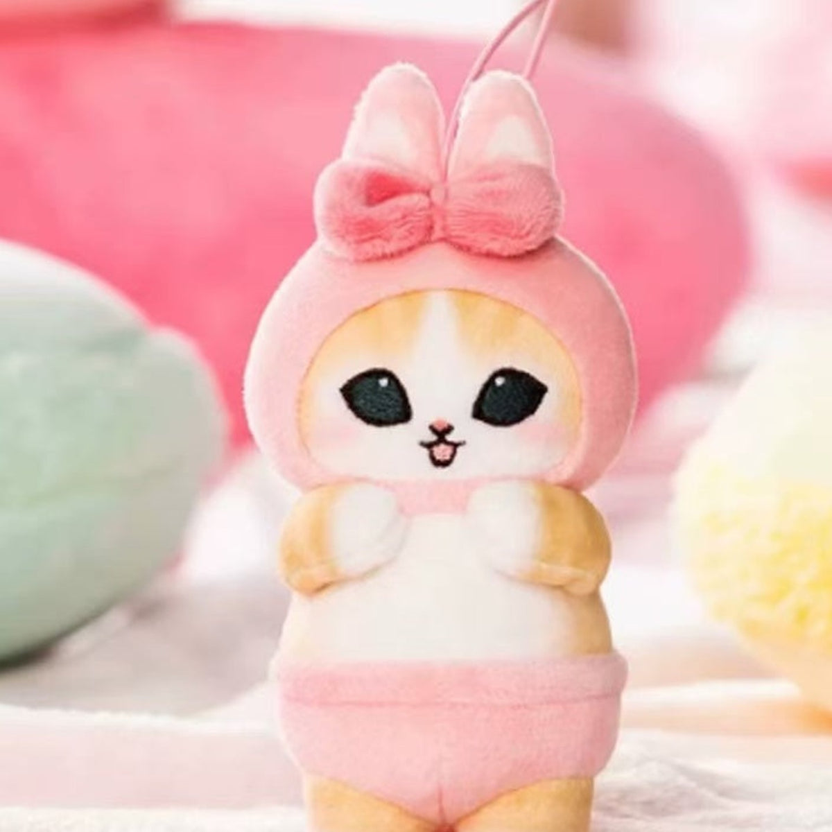 Mofusand pink rabbit-outfit plush pendant, face and outfit detail