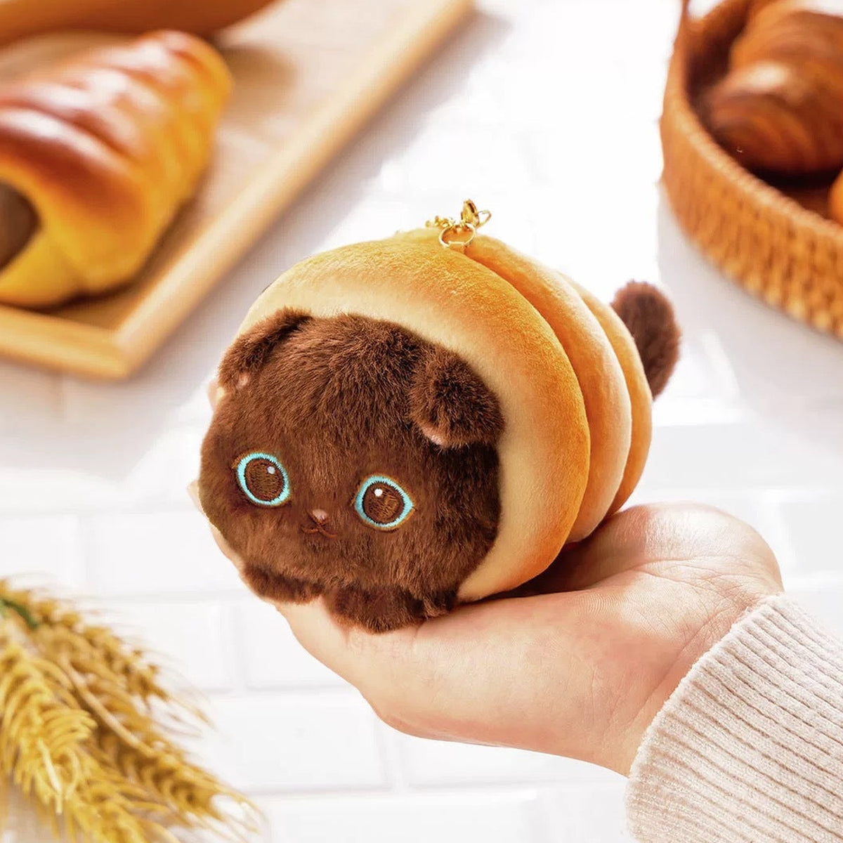 Mofusand Mofumofu Bakery Cat Baking Series Plush Pendant - Dark croissant pendant held in hand; quantity follows selected option