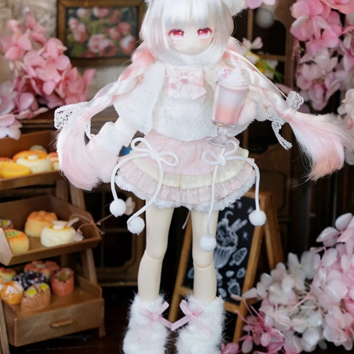 Momotale Four Seasons Tea Tales pale-haired doll in pink layered outfit and lace details; series example