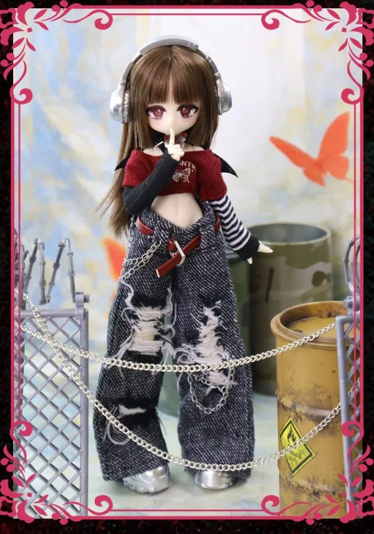 Momotale Butterfly Exclusion Zone MJD doll with headphones, red cropped top, striped sleeves and distressed trousers, full-body design photo