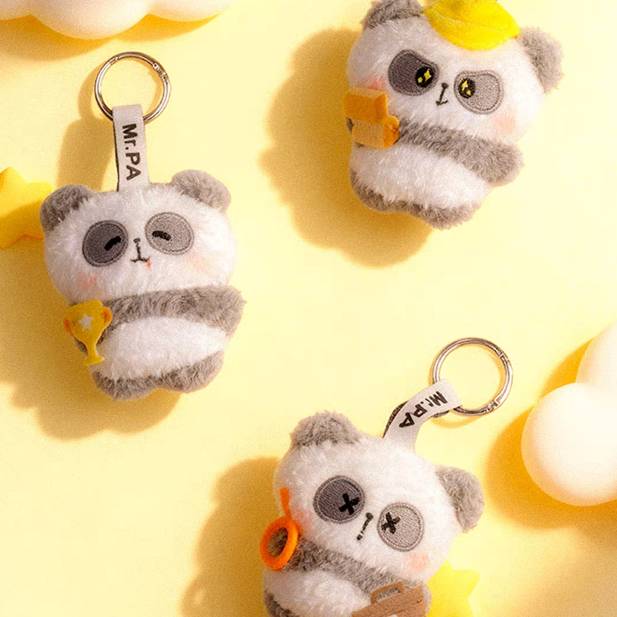 MR.PA'S Daily Office Grind Series Plush Keychain Blind Box - Panda plush keychain overview with complete central example and outer examples cropped; display props not included; random design not guaranteed