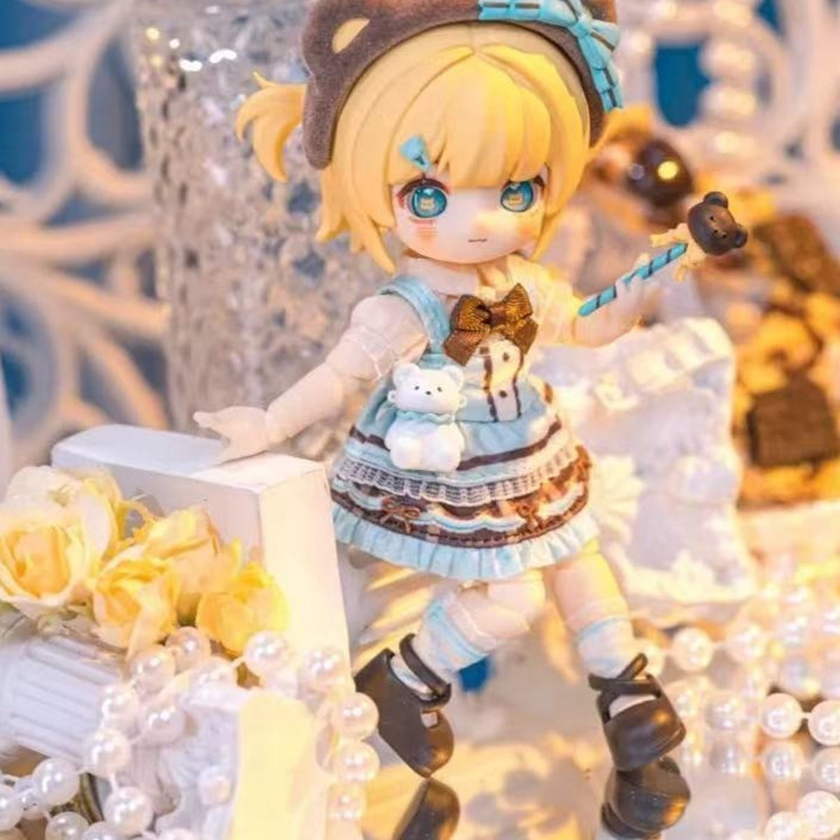 NAGI Illusory Realm bear-hat doll in blue layered outfit with wand and separate bear accessory; series example
