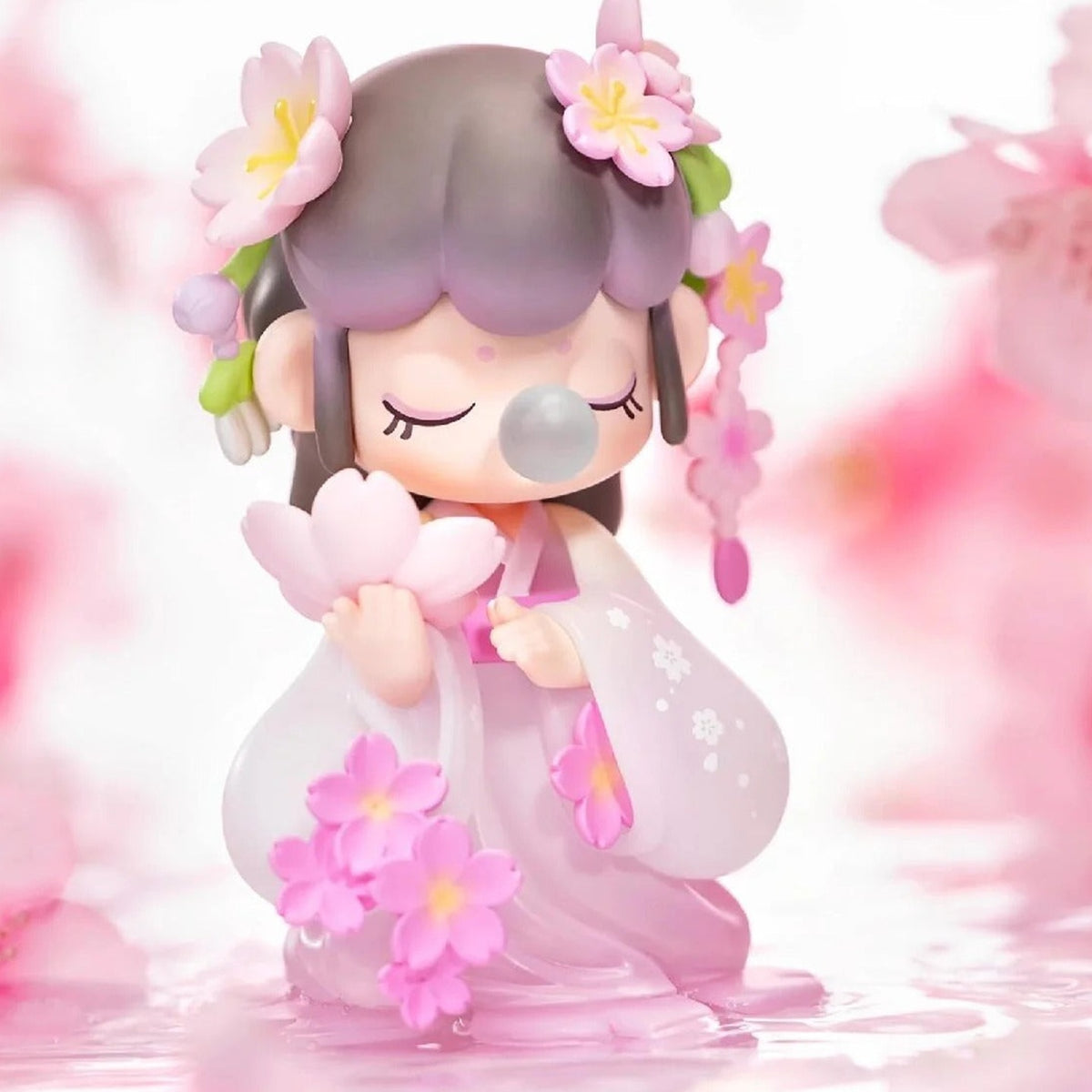 Nanci Flower Stories: Lavender-haired Nanci figure surrounded by pink petals