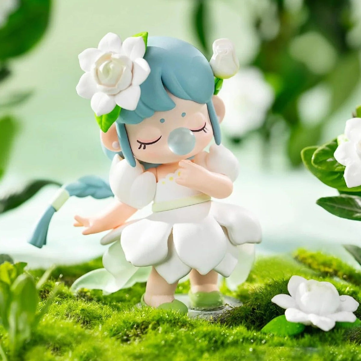 Nanci Flower Stories: Teal-haired Nanci figure styled as a white flower in a garden scene