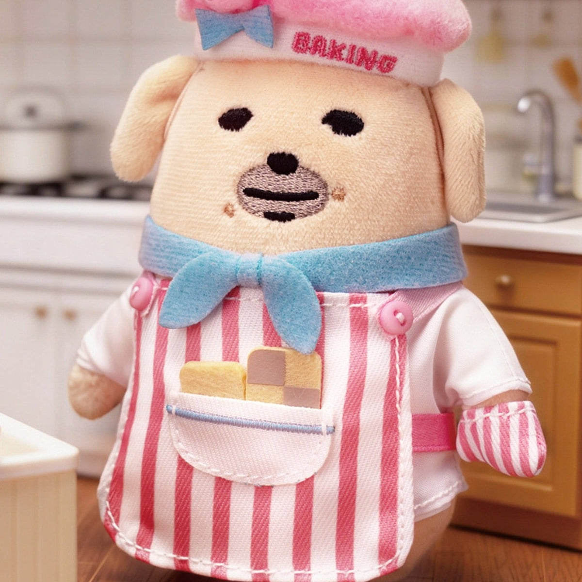 Nudaeng Baking Chef Dog plush pendant: embroidered face and pink chef hat close-up