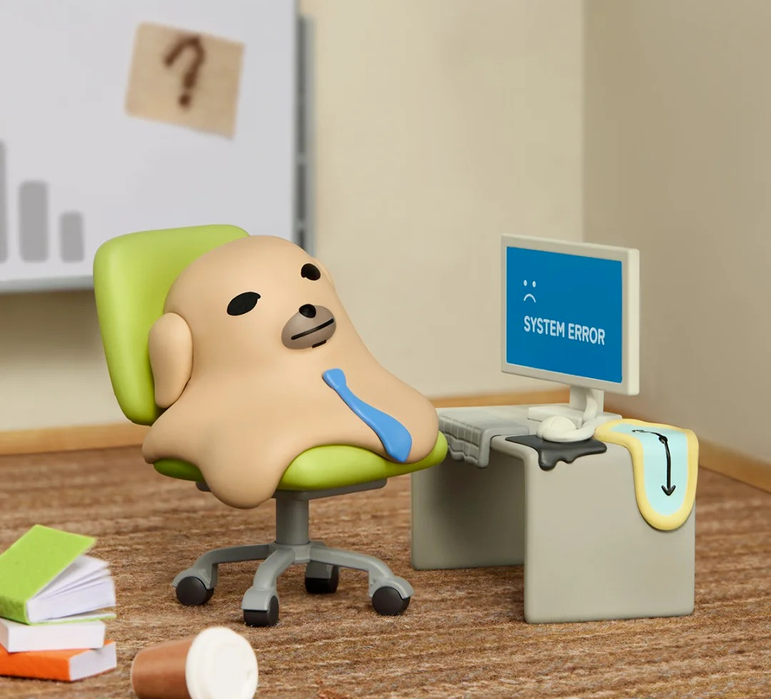 NUDAENG Just Dog It blind-box figure series: dog figure at a desk beside a monitor, shown as a possible design