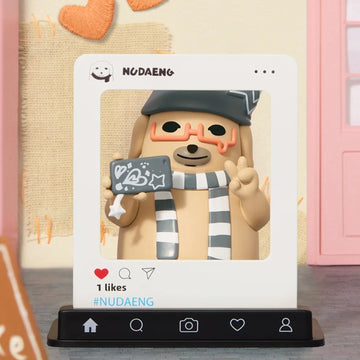 NUDAENG Just Dog It blind-box figure series: dog figure in a photo-style frame, shown as a possible design