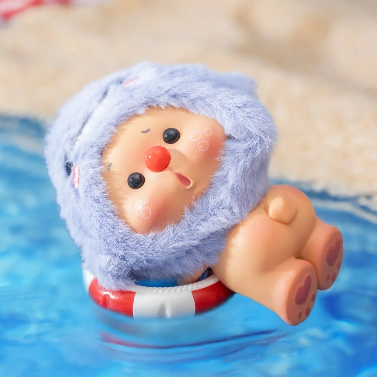 OYO Animal Party Series Mini Figures, Blind Box - Complete blue-costume vinyl-face plush figure example in a styled water scene; imagery does not establish additional supplied accessories; random design not guaranteed