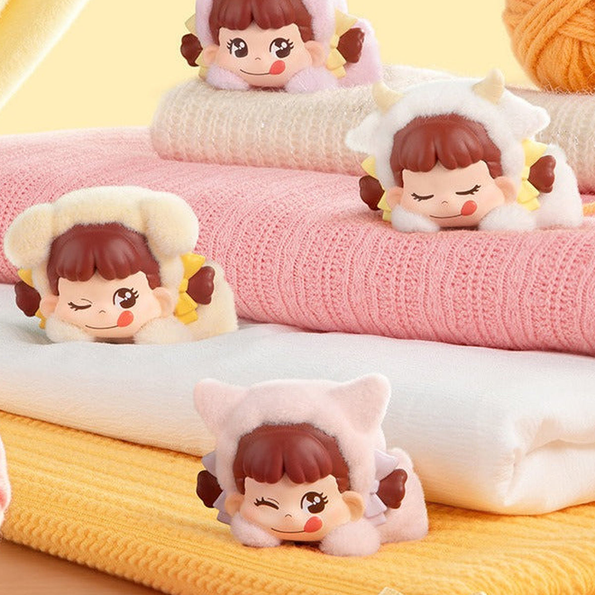 Peko Dream Adventure Series Figure Blind Box - Four head-style mini figure examples in a styled scene; upper ears partly cropped; textiles not included; random design not guaranteed