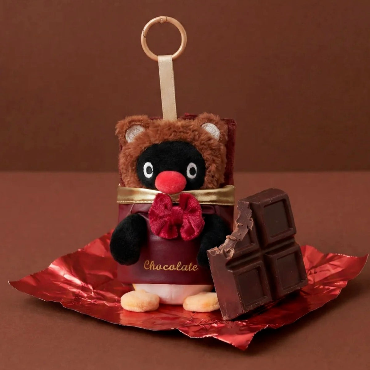 Pingu Chocolate Season Afternoon Tea Time Aroma Plush Pendant Blind Box - Complete Pingu chocolate-costume plush pendant example; chocolate bar is a styling prop; random design not guaranteed