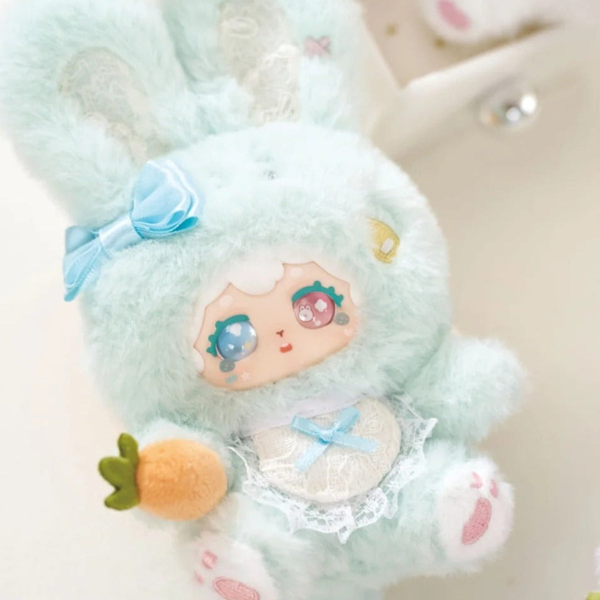 POKA Fluffy Collection: Blue rabbit-suit POKA plush design with carrot detail