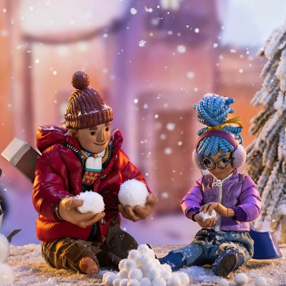 It Takes Two Winter Series Cody and May seated in winter outfits in a snowball scene; purchase follows the selected character or set