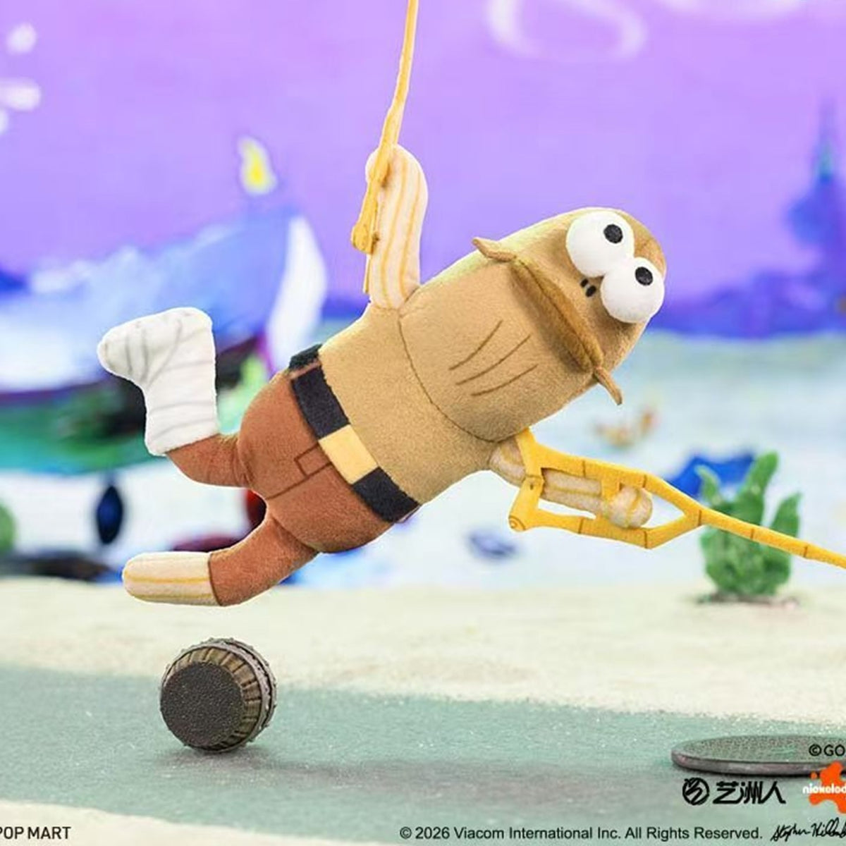 SpongeBob Bikini Bottom V2 tan fish-style plush design with yellow trident-shaped detail, brown trousers and raised leg