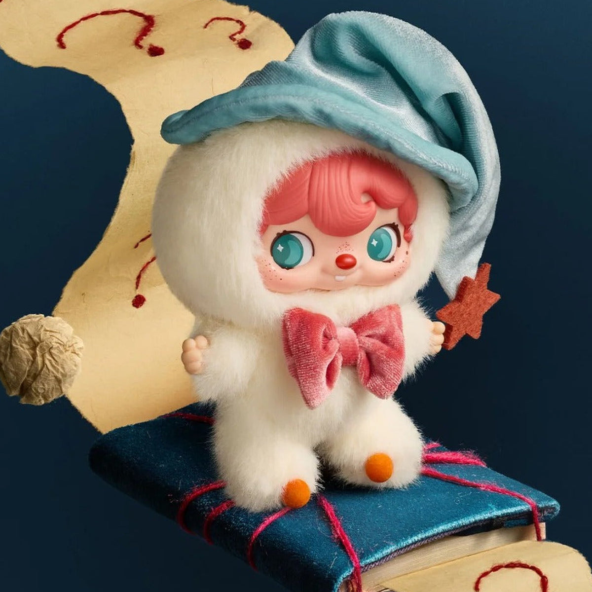 Pouka Pouka Me and Me Series Vinyl Plush Blind Box - Complete pale plush doll example with blue hat on cushion; random design not guaranteed