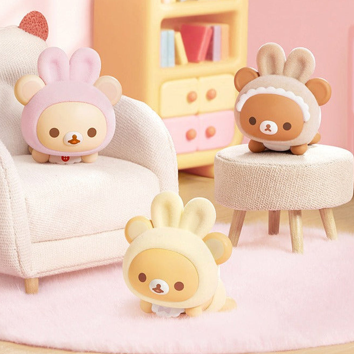 Rilakkuma Minna de Usausababy Series Figure Blind Box - Three complete baby-costume figure examples in a styled room; random design not guaranteed