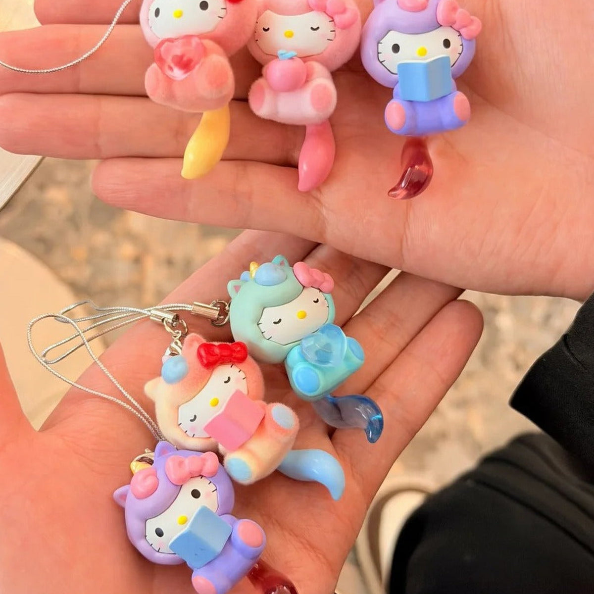 SANRl0 HK Dreamy Adventure Series Mini Figure Blind Box - Mini figure pendants shown in hands with upper examples cropped; pictured design not guaranteed