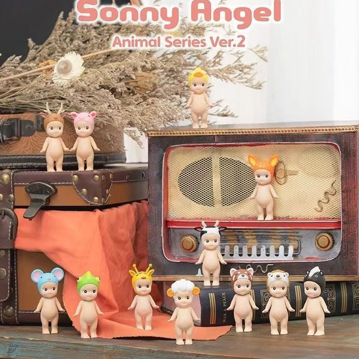 Sonny Angel Animal Series 2: Animal Series 2 mini figures displayed around vintage luggage and a radio