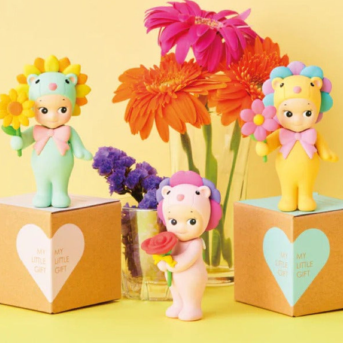 Sonny Angel Flower Gift: Flower Gift mini figures displayed with bright flowers and gift-box props