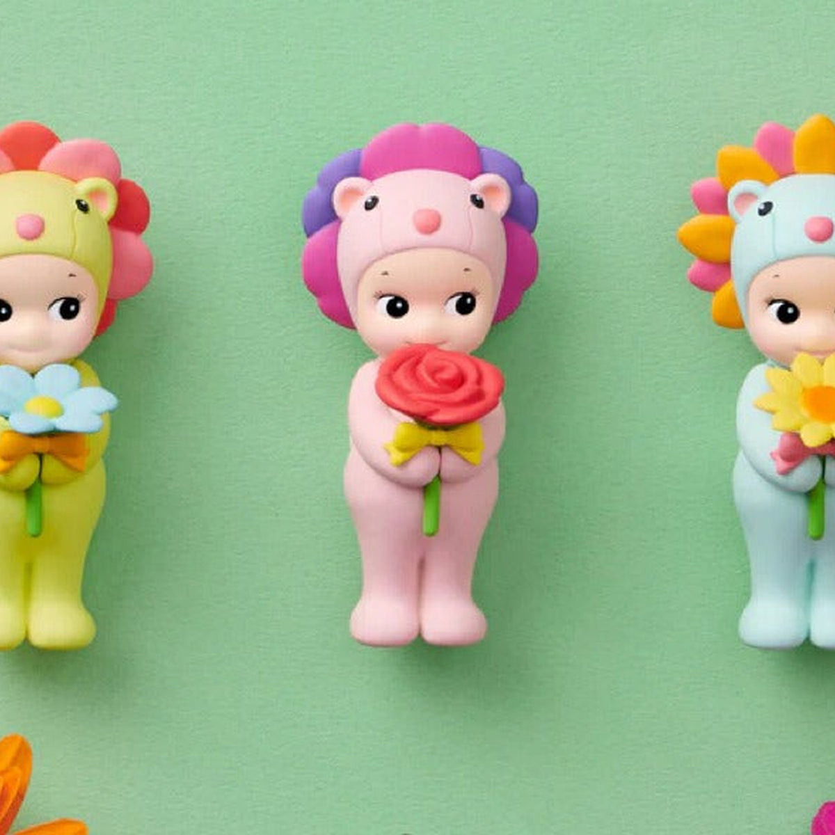 Sonny Angel Flower Gift: Pink Flower Gift mini figure holding a rose with adjacent designs