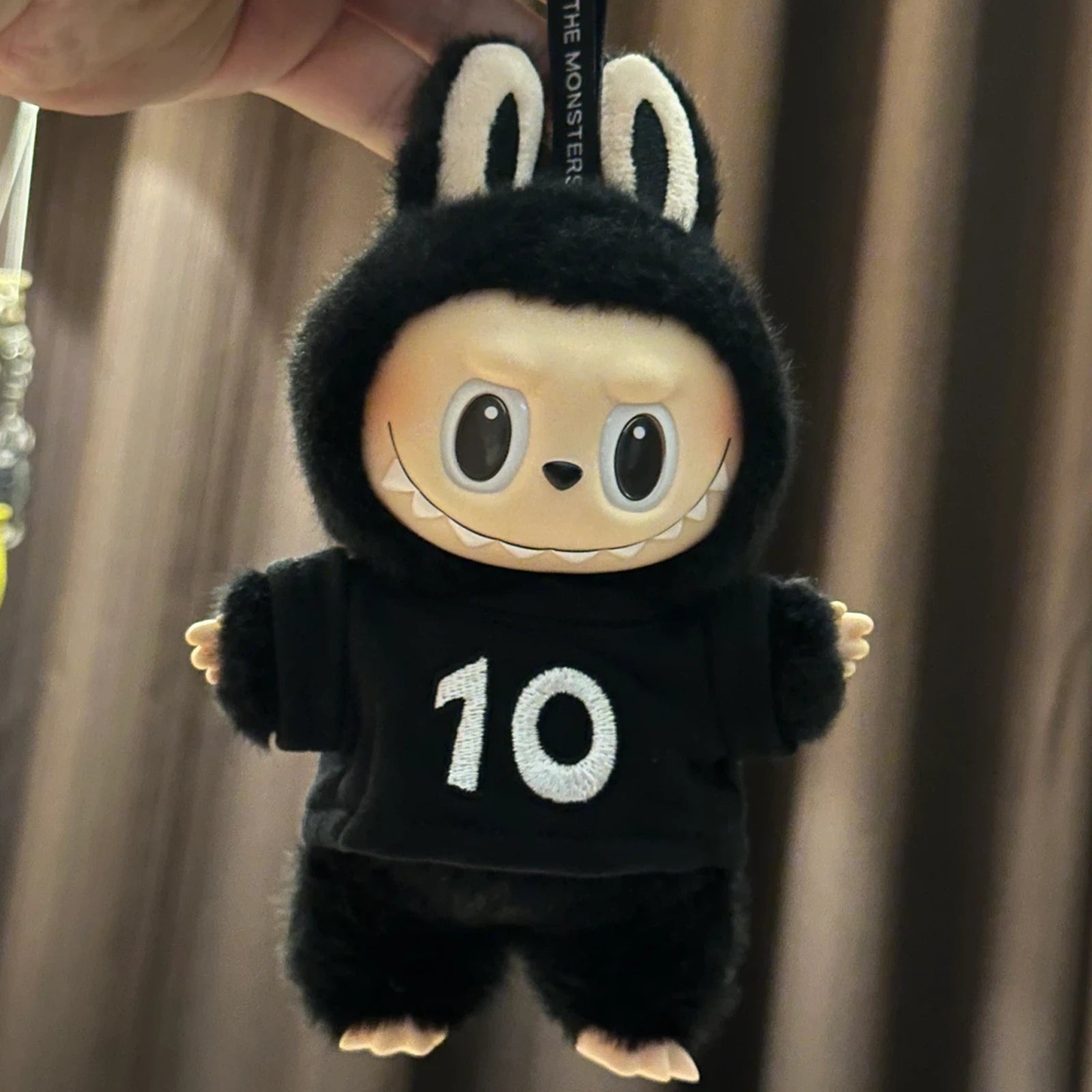 THE MONSTERS 10th Anniversary Tour Series Vinyl Plush Pendant — 17.5cm - front view | KikiBuddies