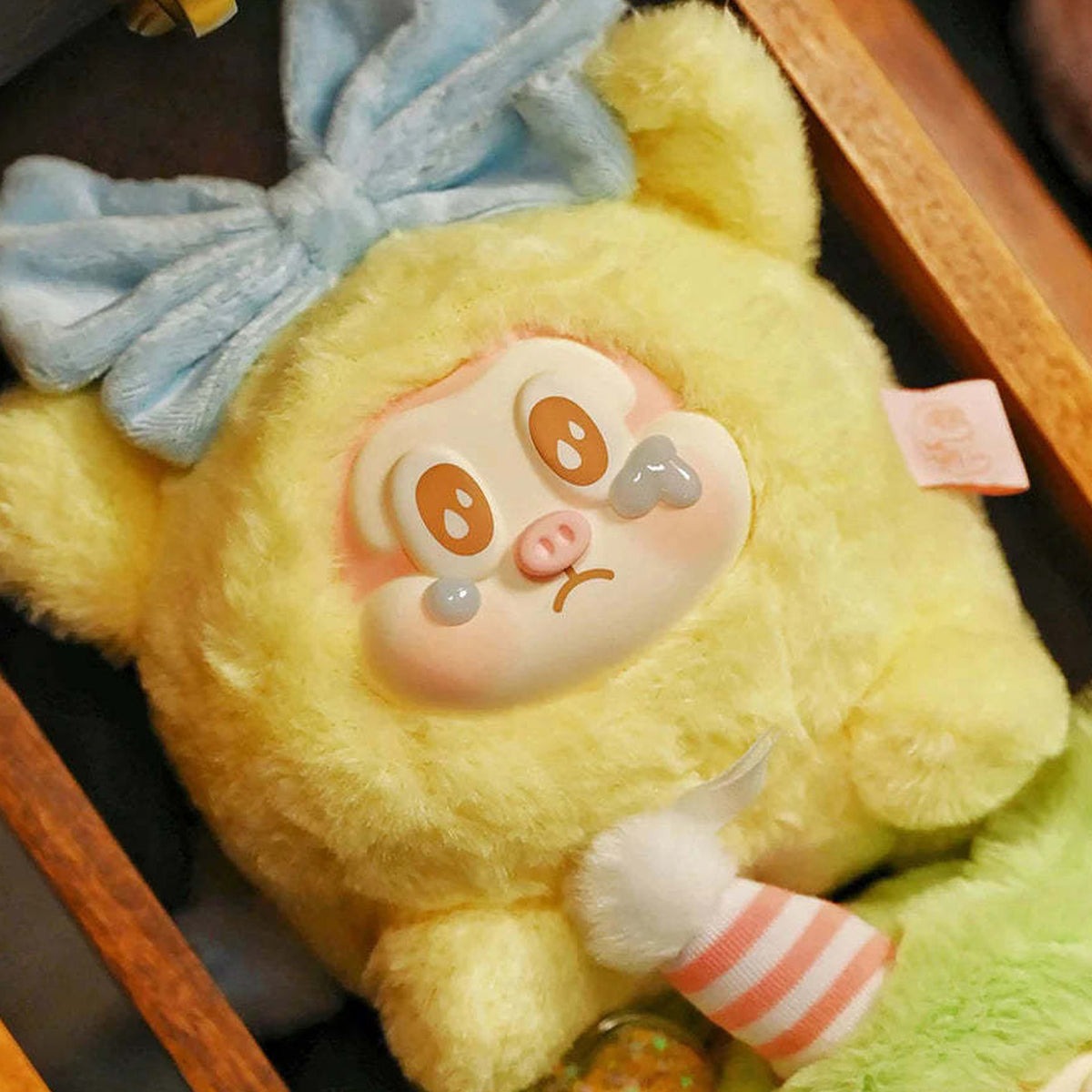 THE SLLO Flying Pig Series Plush Dolls, Blind Box - Yellow plush pendant detail with upper ears cropped; random design not guaranteed