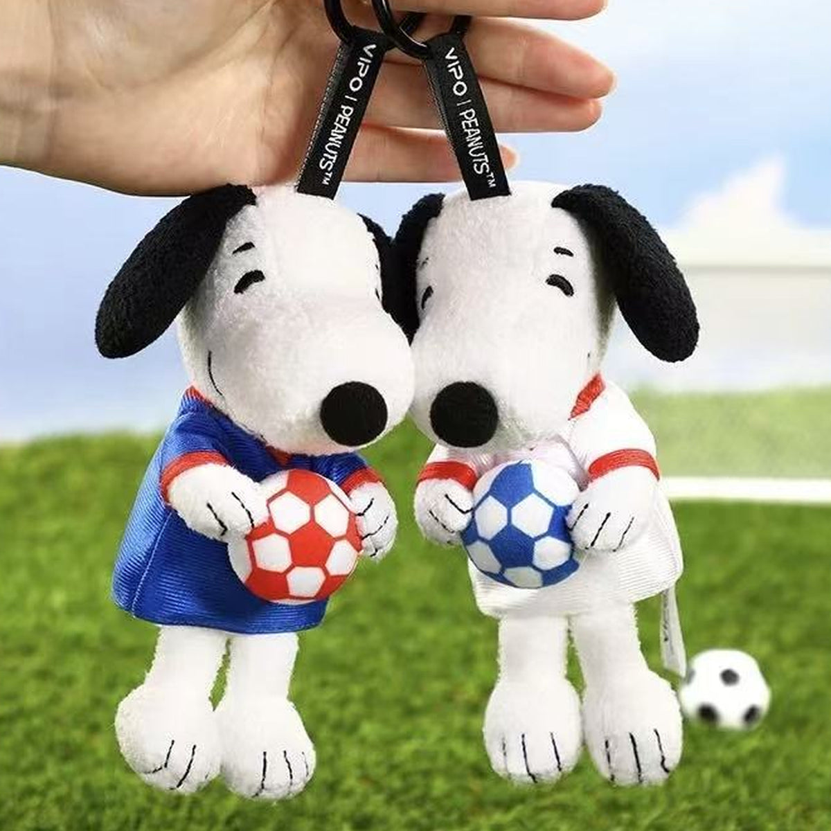 VIPO × PEANUTS Snoopy Football Series Plush Pendant Blind Box - Complete blue and white football plush pendant examples; hand used for scale; random design not guaranteed
