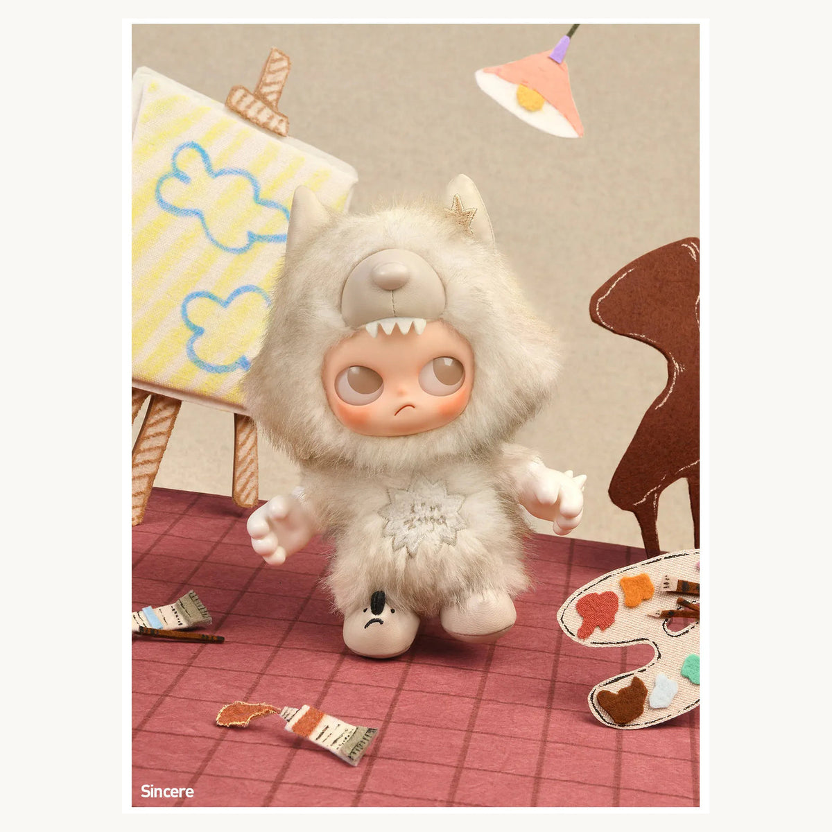 Zsiga I'm Zsiga Sincere confirmed vinyl plush pendant in an illustrated display scene; props are not included