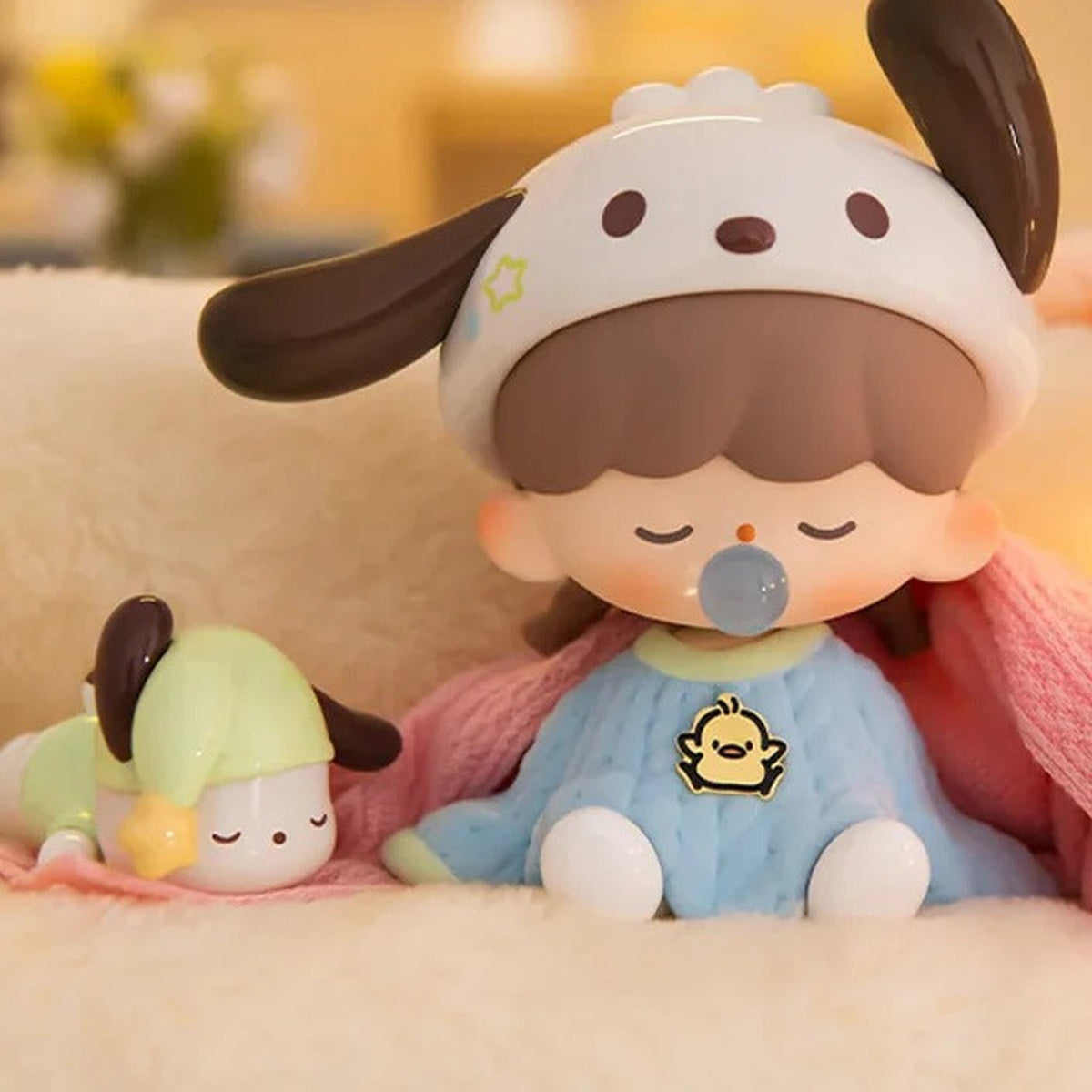 zZoton x Sanrio Preparation Before Bedtime Series Figures, Blind Box - Seated white dog-ear hood design in blue pajamas with small character detail; upper dark ear tip cropped; random design not guaranteed; display props not included